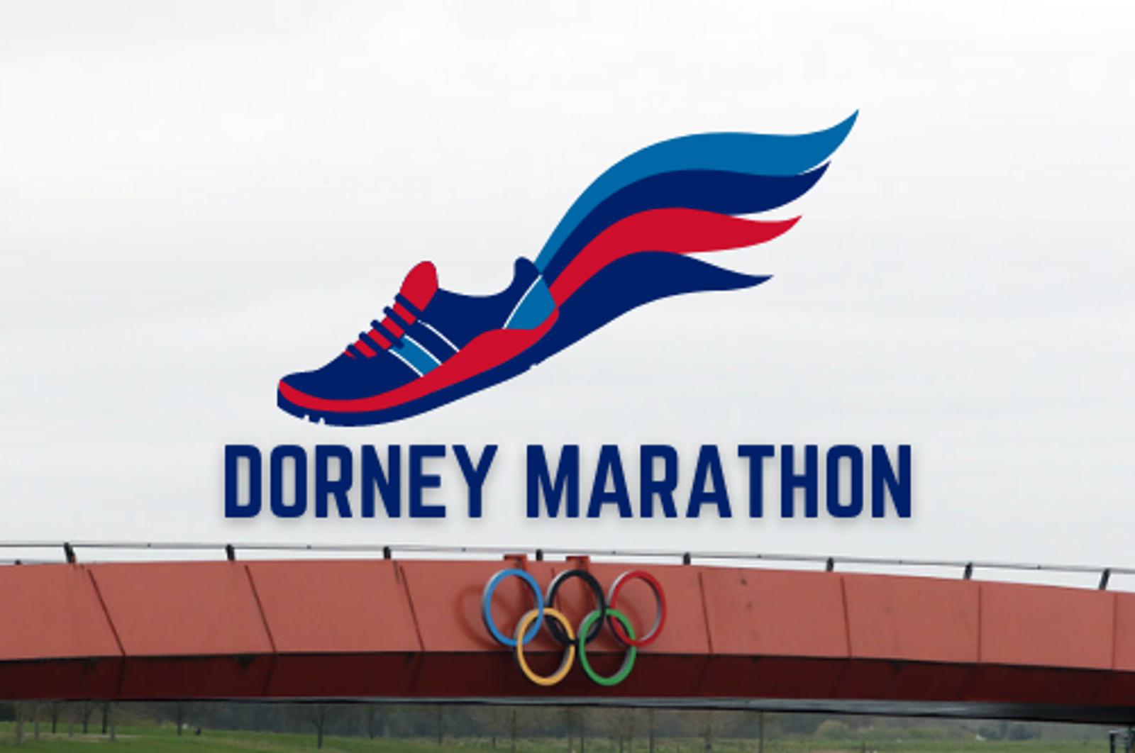 A large sign for the Dorney Marathon features a stylized blue and red running shoe with wing-like extensions. The text "DORNEY MARATHON" is displayed beneath the shoe, and the Olympic rings are visible below the sign, mounted on a red structure.