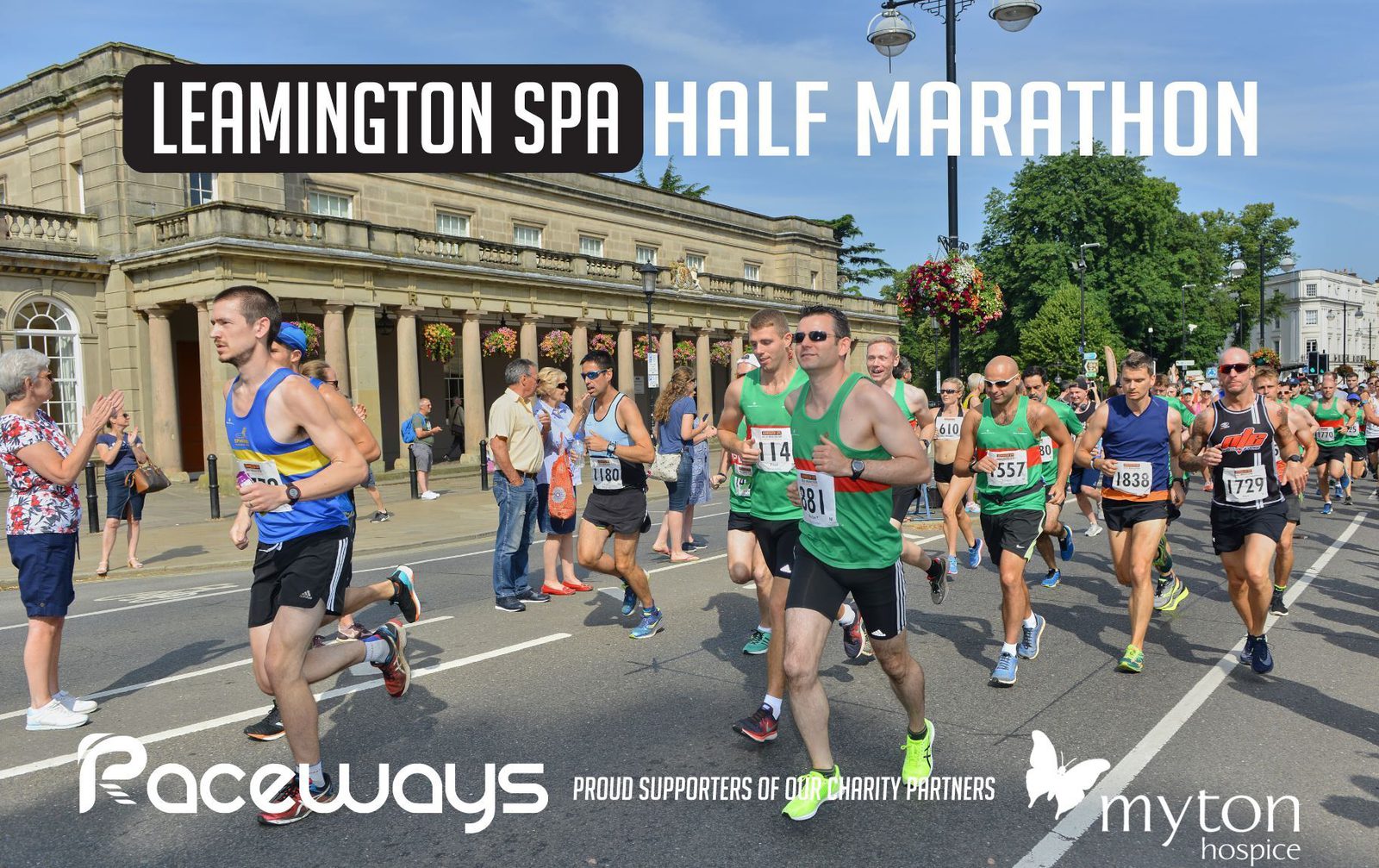 Runners participating in the Leamington Spa Half Marathon are shown in action, racing past historic buildings on a sunny day. The image features diverse runners wearing various bib numbers and colorful athletic gear. Banners display "Raceways" and "Myton Hospice" logos.