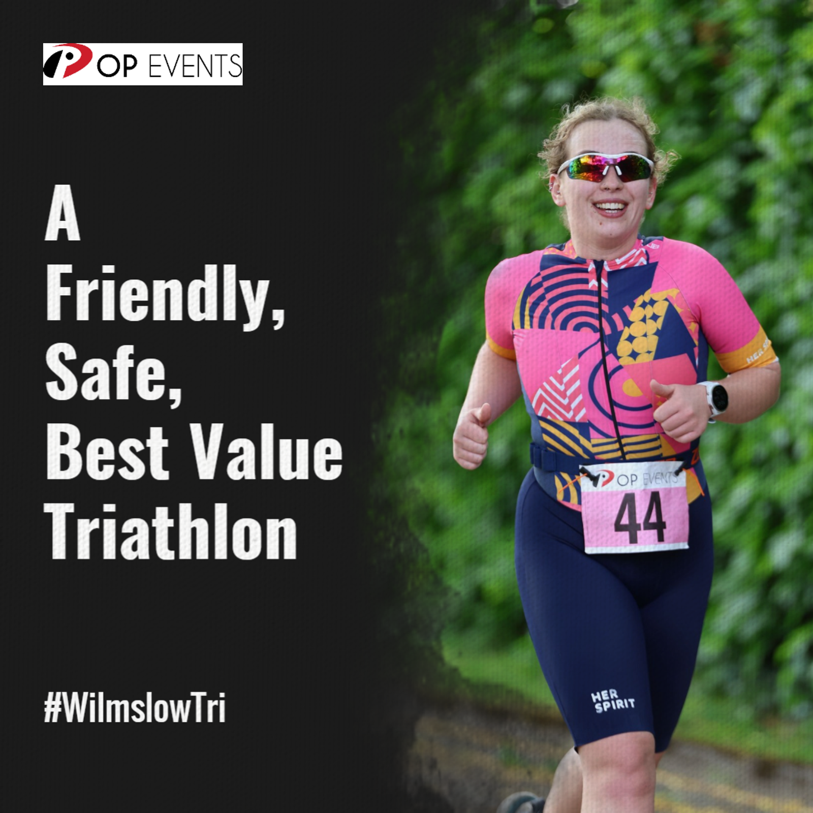 Smiling athlete running in a pink and navy tri suit with race number 44, promoting a friendly, safe, best value triathlon by OP Events. #WilmslowTri is displayed in the corner. Green foliage in the background.