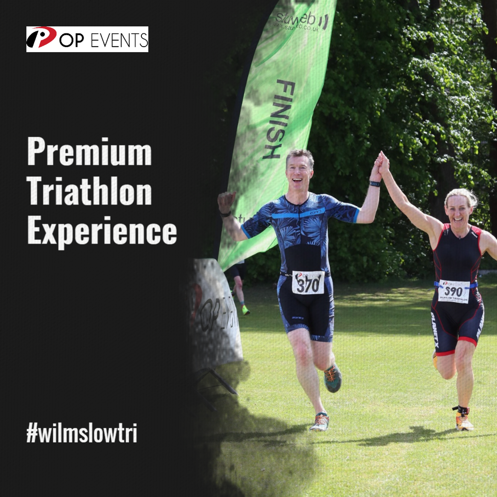 Two triathletes, wearing race numbers 370 and 390, smile and hold hands as they cross the green finish line outdoors, with "Premium Triathlon Experience" and #wilmslowtri text beside them.