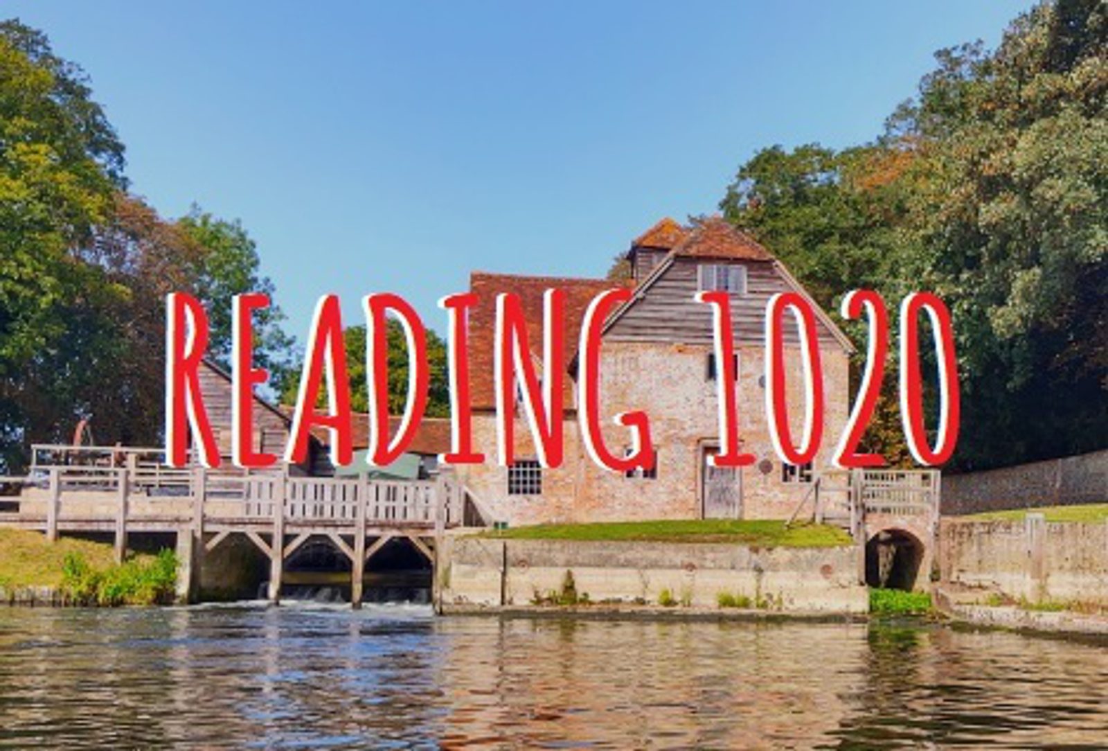 A riverside scene features a historic, brick watermill building surrounded by lush trees under a clear blue sky. The words "READING 1020" are prominently displayed in red over the image. The calm river reflects the charming structure and greenery.