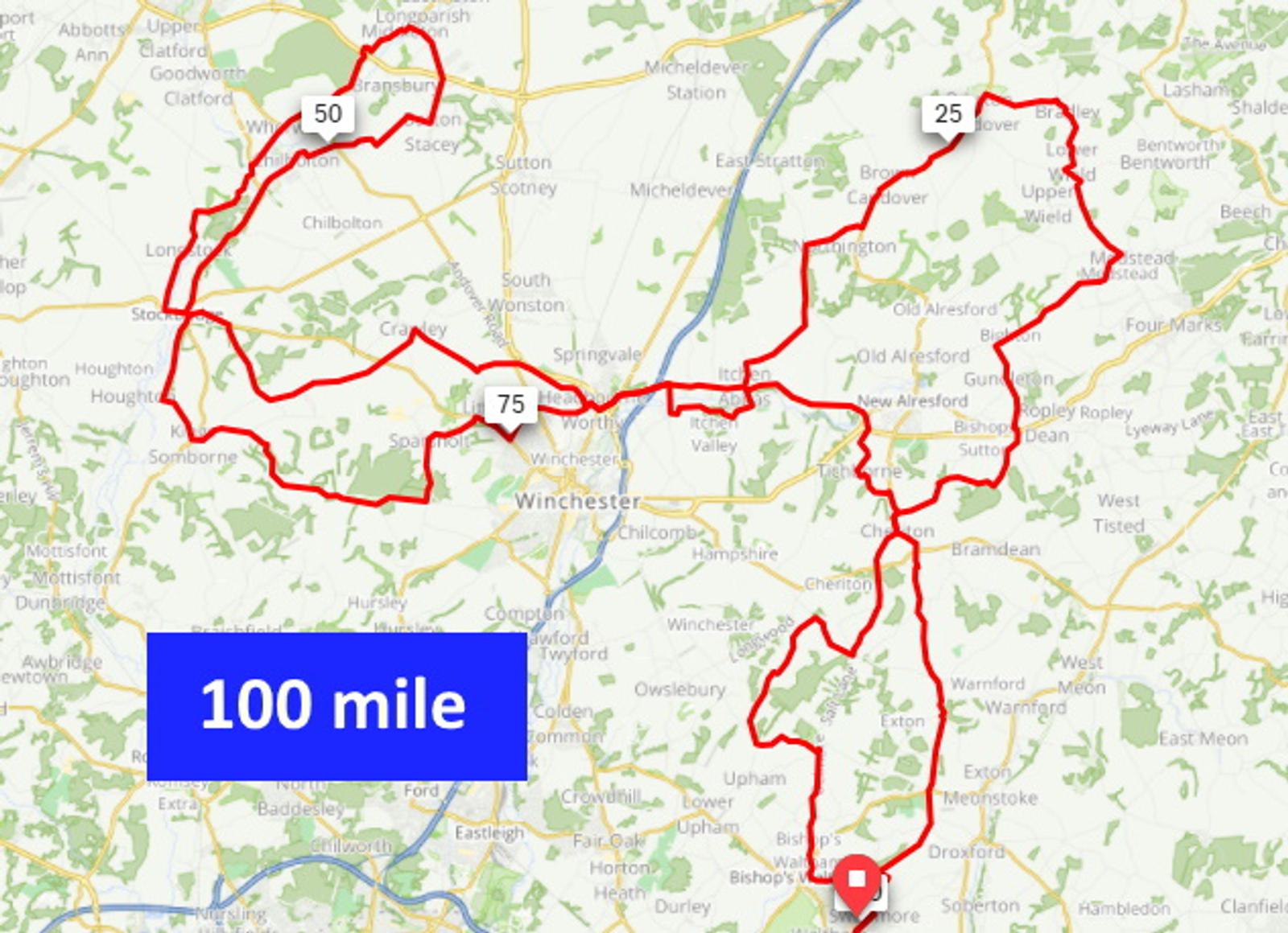 A map showing a 100-mile cycling route around Winchester, marked in red. The route has three highlighted checkpoints at approximately 25 miles, 50 miles, and 75 miles. The area is filled with green markings indicating natural or rural regions.
