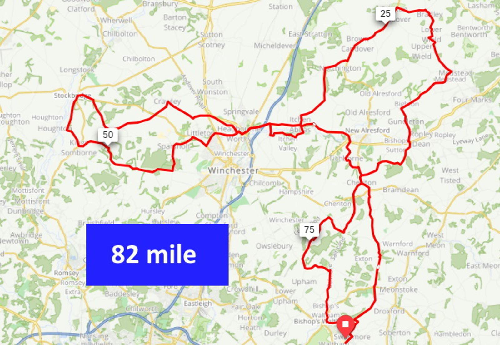 A map showing a cycling route. The route forms a large loop passing through and around several towns, including Winchester. The route is 82 miles long with markers at 25, 50, and 75 mile points. The background is largely rural with scattered green areas and roadways.