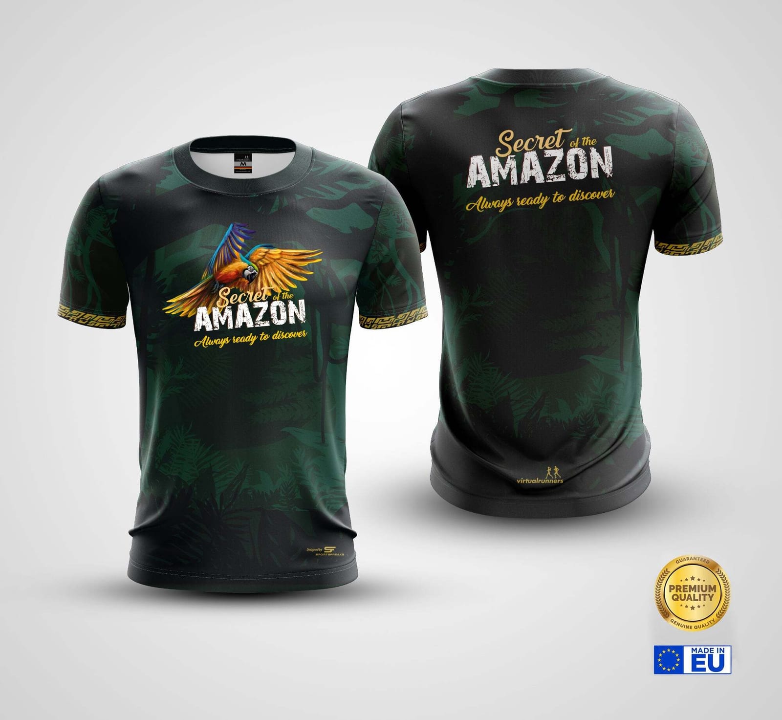 Two dark green T-shirts with jungle prints laid flat, front and back views. Each features a colorful bird and reads "Secret of the Amazon, Always ready to discover." Gold text accents and quality assurance badges are present.