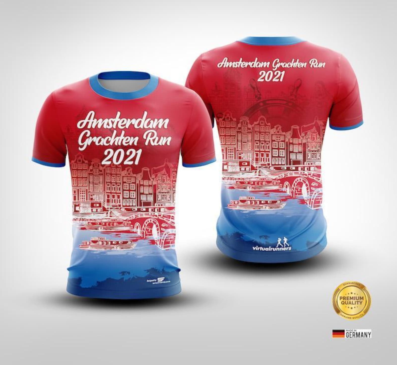 Front and back views of a red and blue T-shirt with a white cityscape design. The text reads "Amsterdam Grachten Run 2021." The shirt displays the Team Germany logo and the labels "Premium Quality" and "Manufactured with Love in Germany" at the bottom.