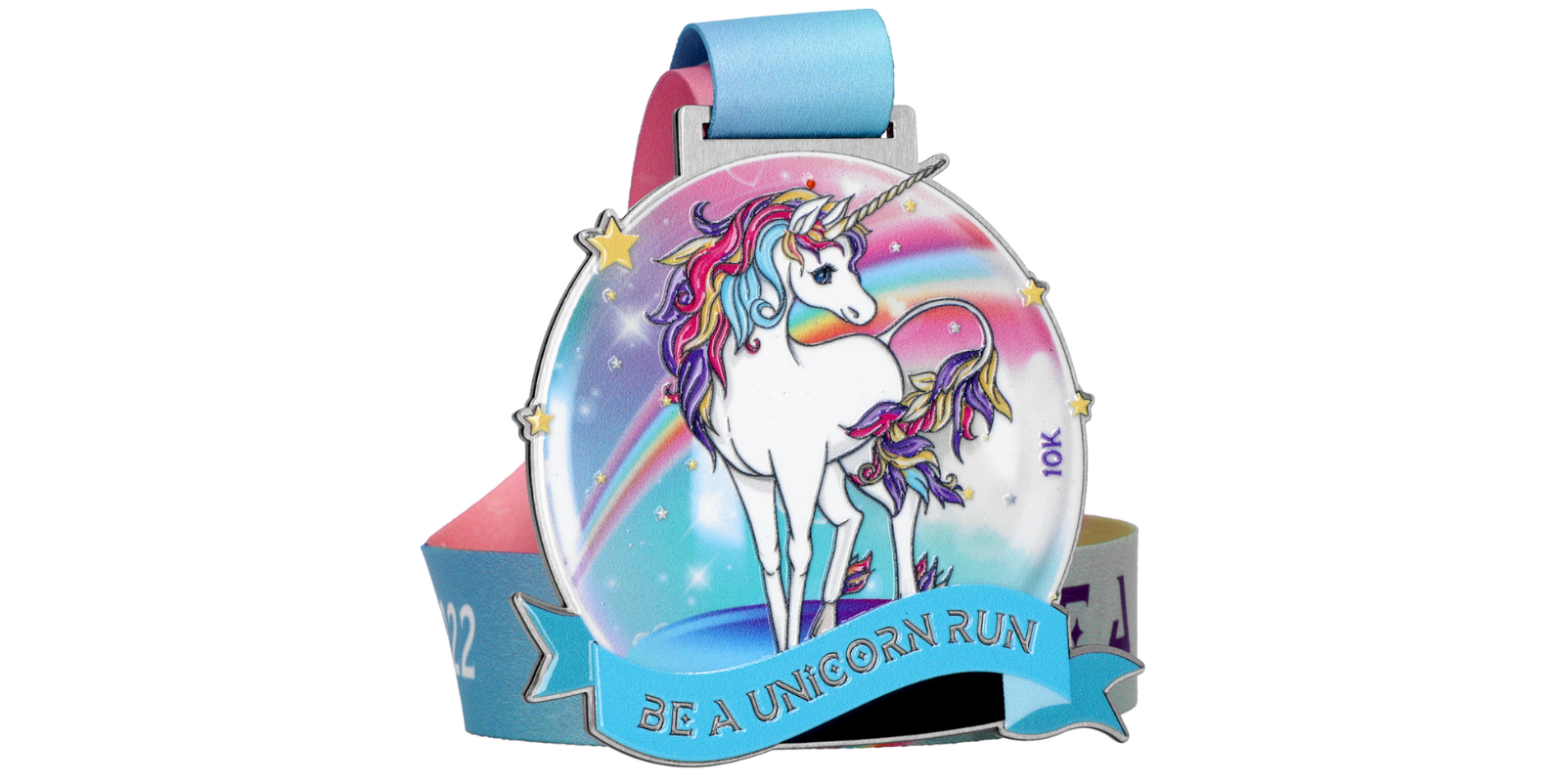 A colorful medal features a white unicorn with a rainbow mane and tail against a rainbow background. The text on a blue ribbon at the bottom reads "BE A UNICORN RUN." The attached ribbon is also colorful, matching the vibrant theme of the medal.