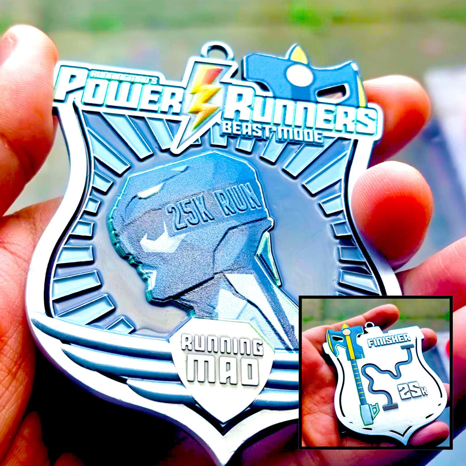A hand holds a medal with the text "Power Runners Beast Mode" and "25K Run." The medal features a stylized runner and a course map on the back, with "Finisher" and "25K" engraved.