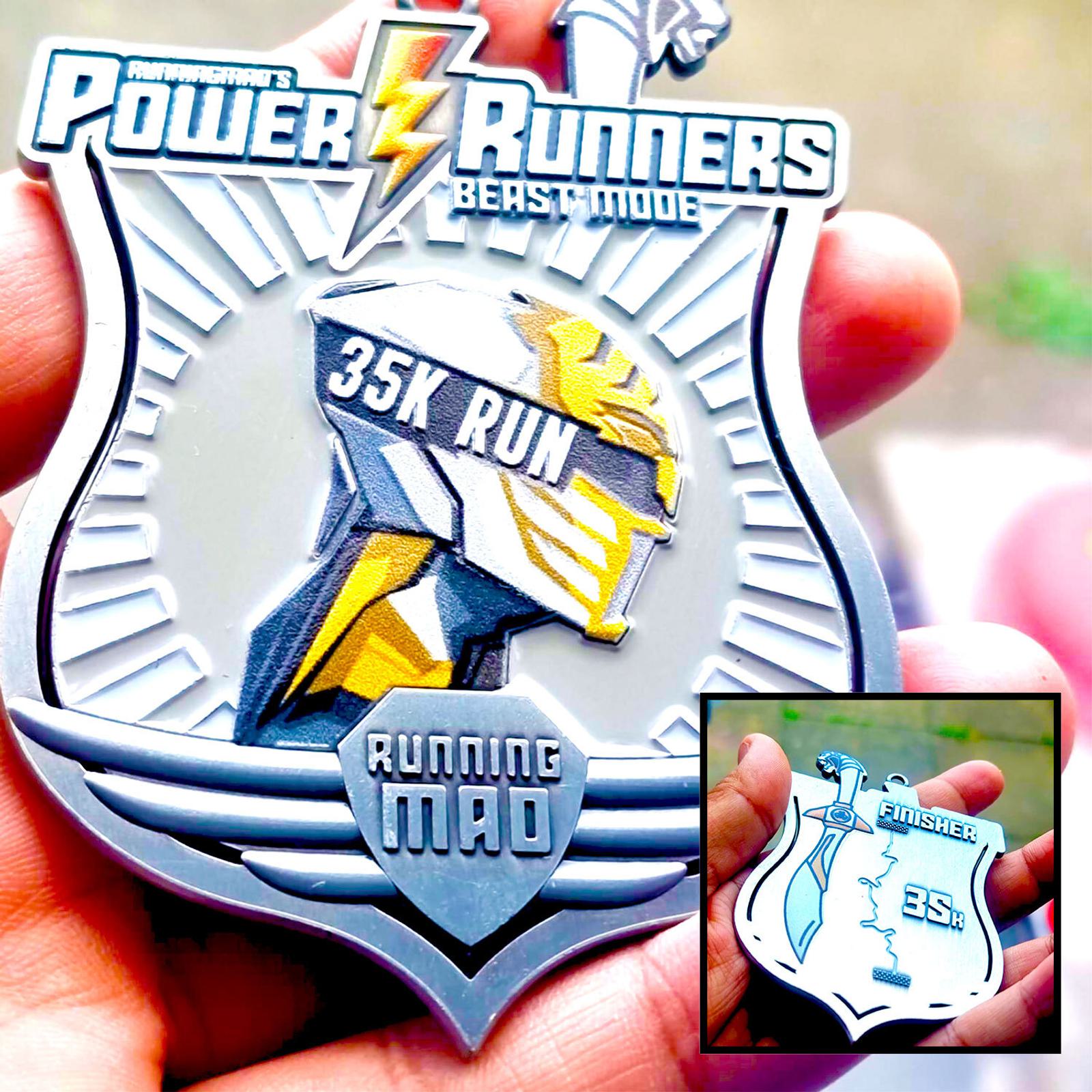 A person holds a medal with "Power Runners Beast Mode 35K Run" and a helmet design. Below it says "Running Mad." An inset shows the back of the medal with "Finisher" and "35K Run.