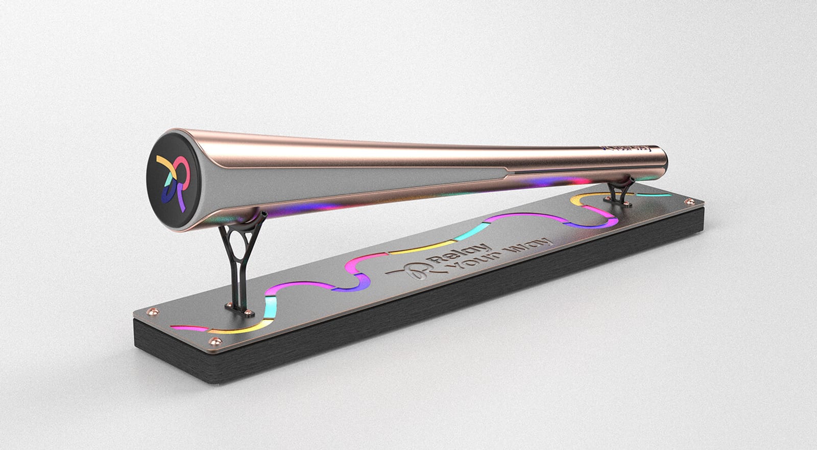 A metallic bat-shaped trophy with a shiny, iridescent finish is mounted on a black rectangular base. The base displays a colorful wavy line and engraved text, including the words "Rainy" and "Your Win.