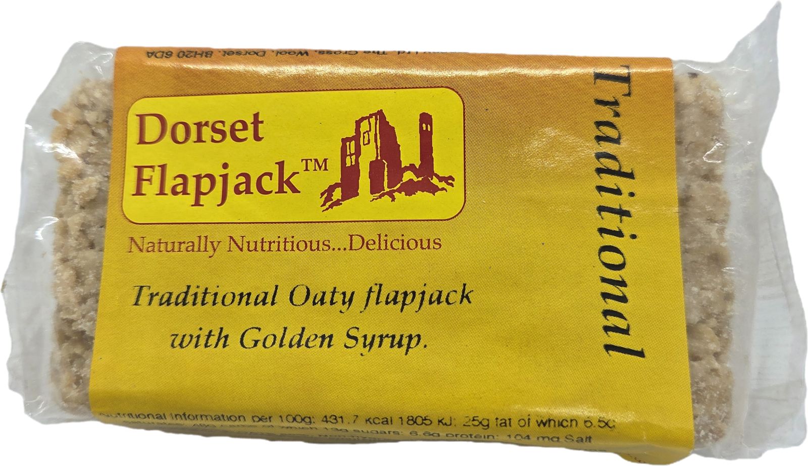 A packaged Dorset Flapjack labeled "Traditional Oaty flapjack with Golden Syrup" in yellow wrapping with an illustration of a historic building. The flapjack bar is visible through the transparent packaging.