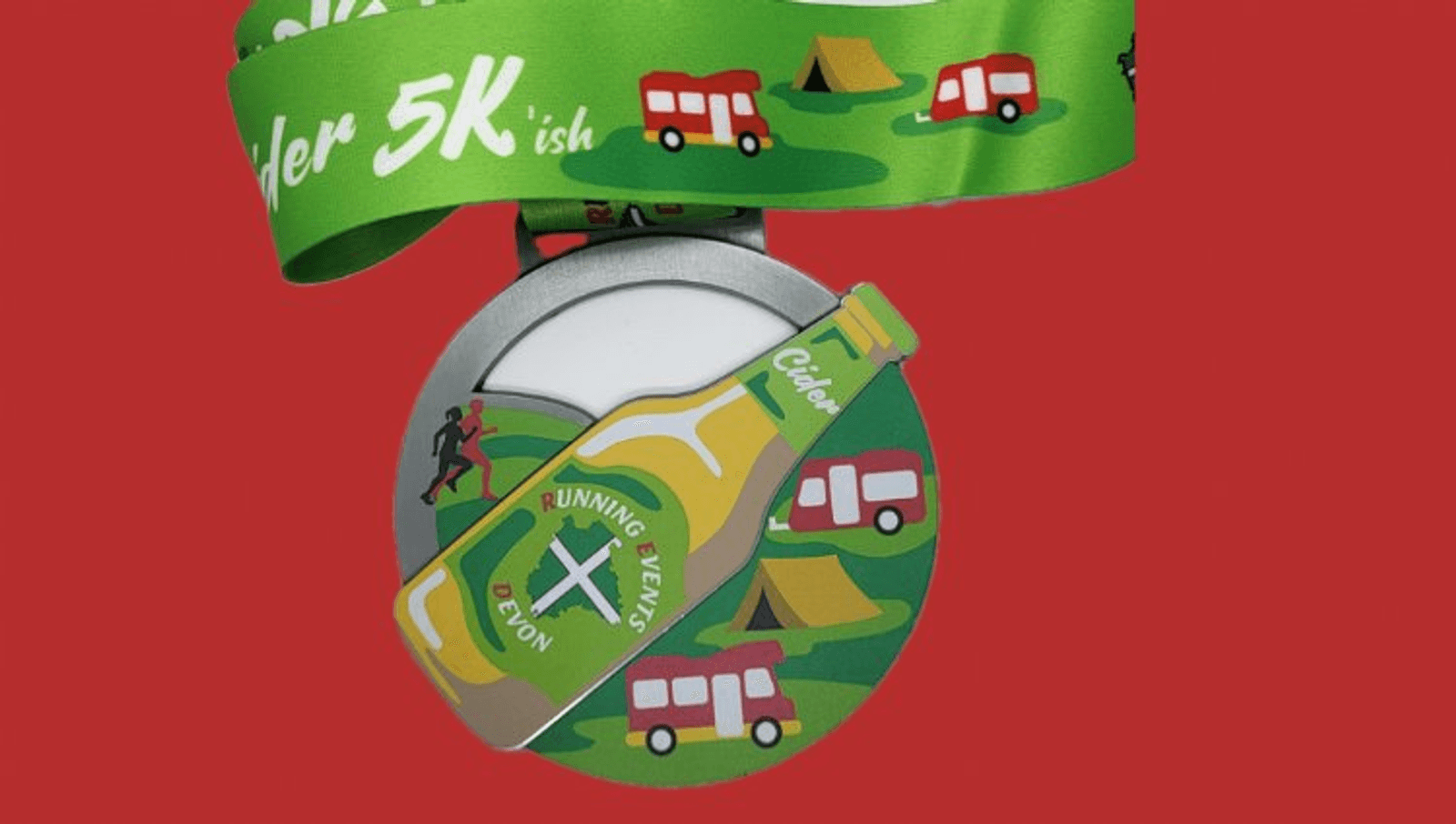 A colorful "Cider 5Kish" race medal with a green ribbon showing red camper vans and tents. The medal features a cider bottle labeled "Running Events Devon" on a green landscape background.