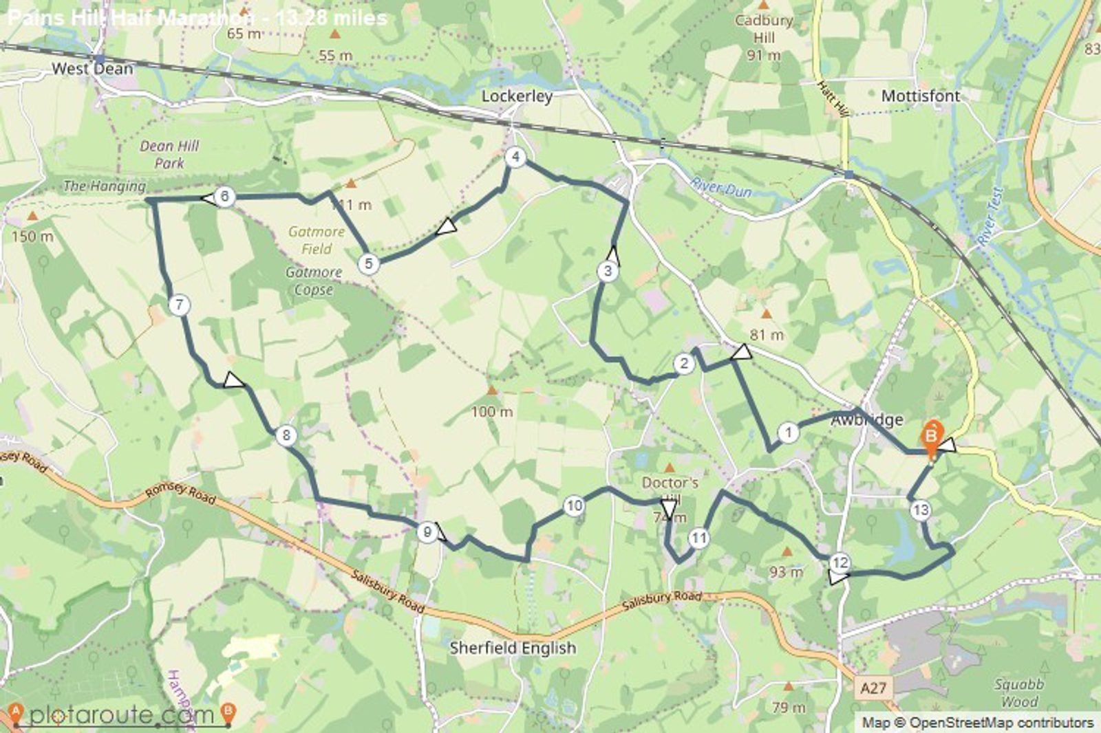 A detailed map highlighting a 12.8-mile hiking route titled "Paris Hill Half Marathon." The trail is marked with numbered points (1-15) and passes through areas such as Dean Hill Park, Gatmore Field, and Lockerley before looping back to the starting point.