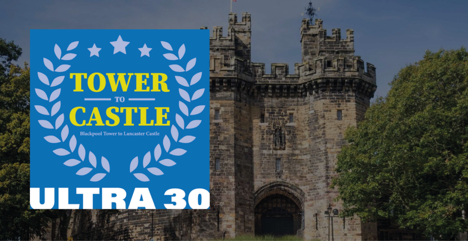 A stone castle entrance with two towers is partially covered by a blue graphic. The graphic reads "Tower To Castle" with "Ultra 30" at the bottom. The event spans from Blackpool Tower to Lancaster Castle. Green trees are in the background on either side of the castle.
