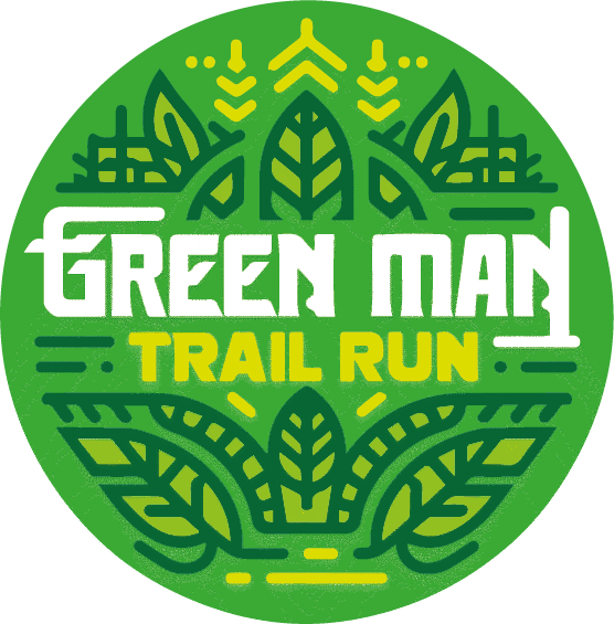 Logo for the "Green Man Trail Run" featuring stylized green and yellow leaf and plant designs within a circular shape. The text "Green Man Trail Run" is prominently displayed in the center.