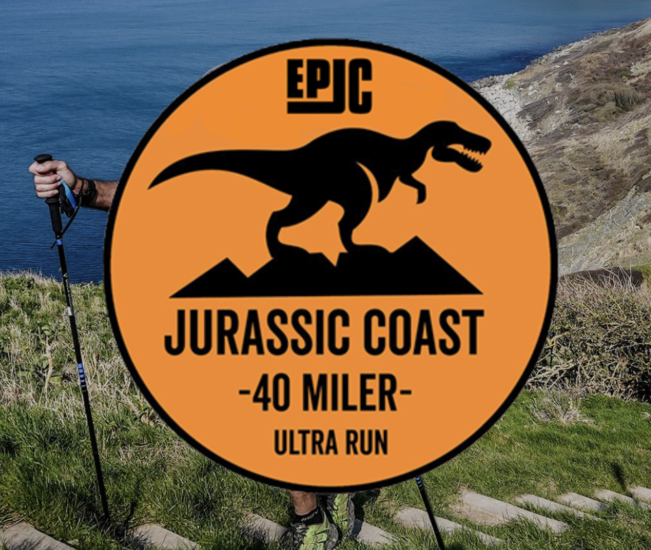 A logo for the "Epic Jurassic Coast 40 Miler Ultra Run" featuring a black silhouette of a dinosaur on an orange background. In the background, a hiker with poles walks along a grassy coastal path.