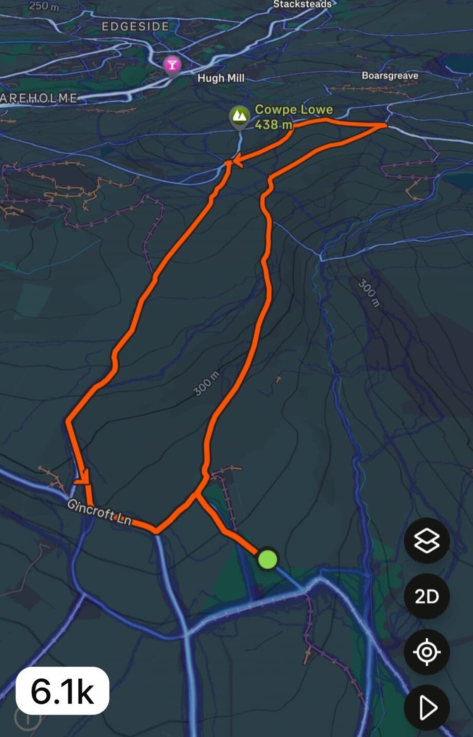 A digital map displays a hiking route marked in orange, looping from Gincroft Lane to Cowpe Lowe (438m), with nearby locations labeled, including Hugh Mill and Edgeside. The distance 6.1k is shown. 2D and settings icons are visible.