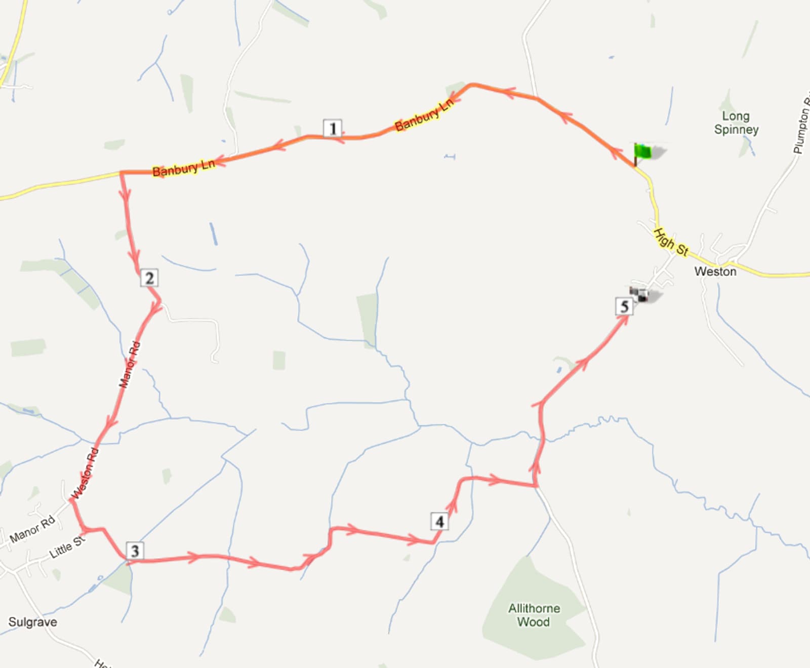 A map showing a route marked in red. The path starts at High St, heads through Banbury Ln, Manor Rd, and then loops back to the starting point. The route passes numbers 1 to 5 and areas labelled as Long Spinney and Allithorne Wood.