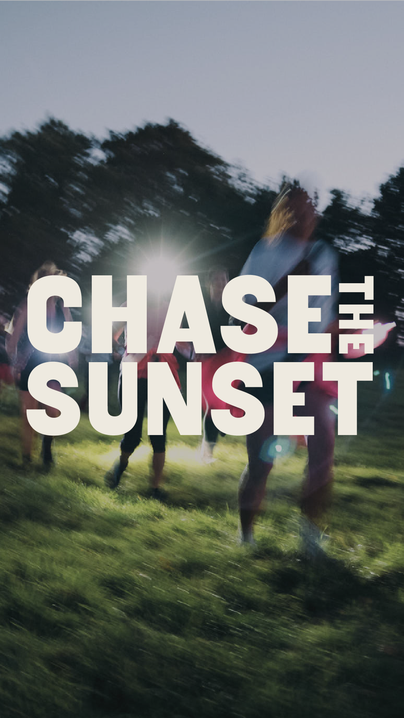 A group of people run across a grassy field at dusk with blurred motion, trees silhouetted in the background. Large white text in the center reads “CHASE THE SUNSET.”.